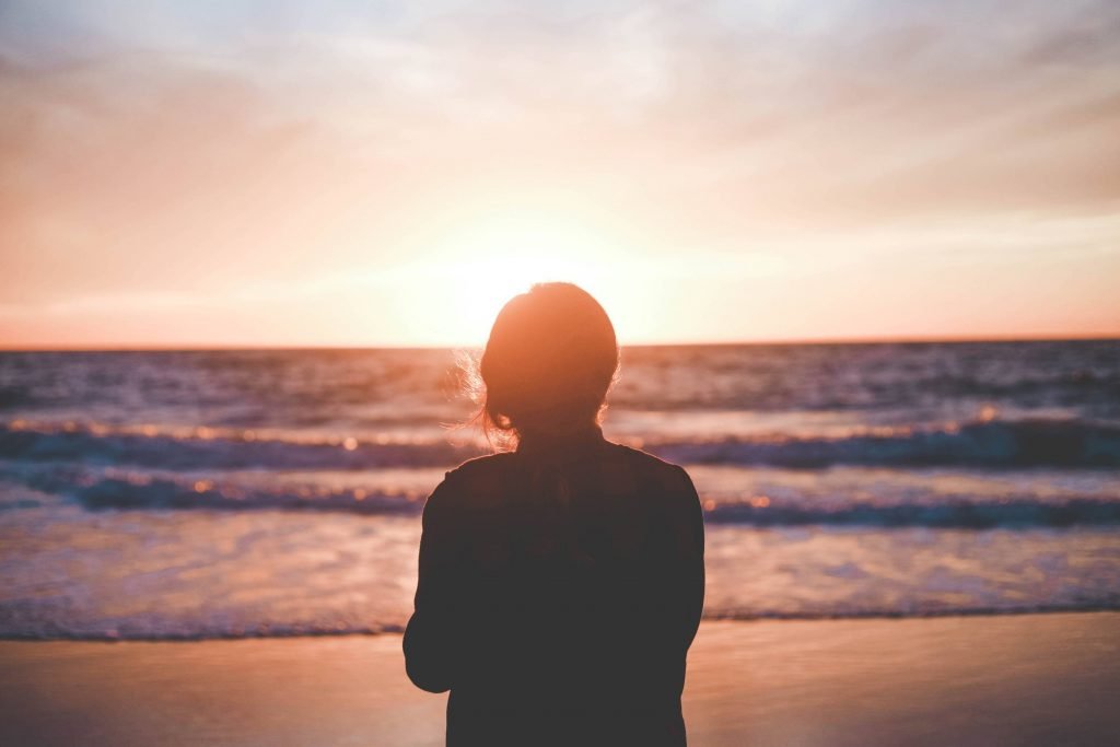 woman standing on beach