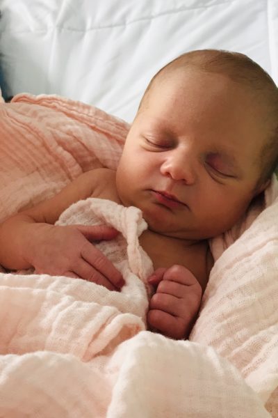 baby wrapped in pink blanket