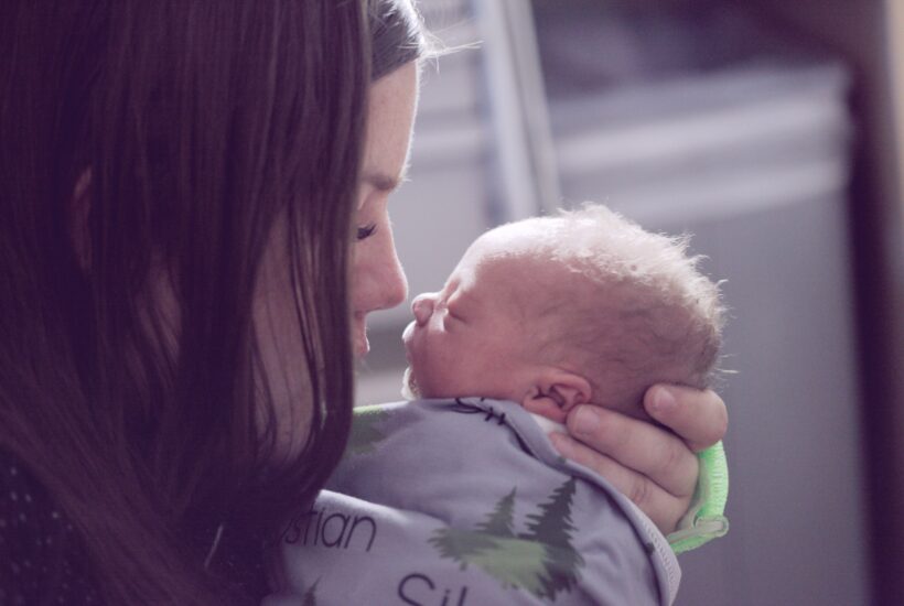 mom holding baby